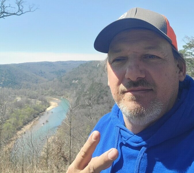 Rod with Buffalo River Behind 